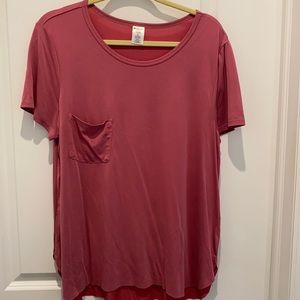 Mauve in color pocket T with no hem